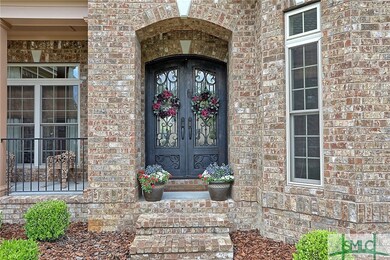 An arched front porch with exquisite double front