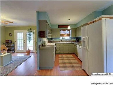 Family room opens to kitchen, not often found in t