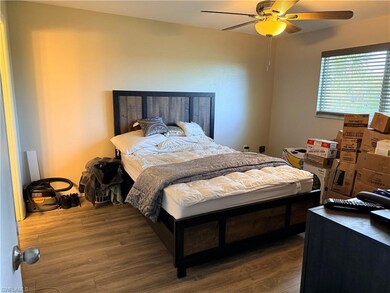 Bedroom with wood finished floors and ceiling fan
