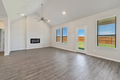Living Room in the Masters home plan by Trophy Signature Homes – REPRESENTATIVE PHOTO