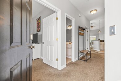 Hall with sink and carpet flooring