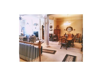 Sun filled formal dining separated from formal liv