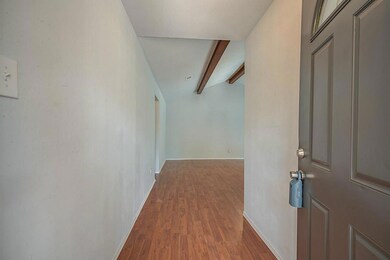 Elegant Entry w/ Impressive Laminate Wood Flooring