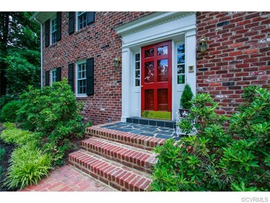 Beautiful entry way with brick and slate porch and
