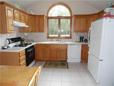 Kitchen. Ceramic floors..Atrium Window..Oak Cupboa