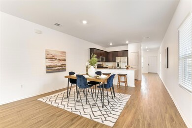 Dining area featuring light wood-style flooring a