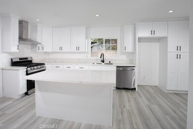 Kitchen - New white shaker cabinetry that reaches the ceiling, New black hardware, New slow/soft closing doors/drawers, New lazy-Susan feature, New pantry, New pull-out waste bins, New quartz counter tops, New stainless steel under mount basin, New p