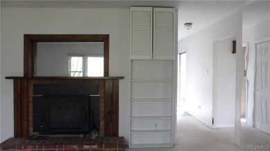 Living Room Fireplace with Mirror Above and Built-