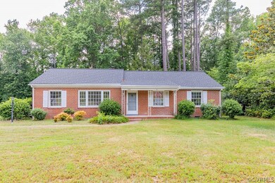 Ranch-style house featuring a front lawn