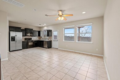 Kitchen featuring tasteful backsplash, visible ve