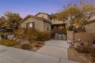 View of front of property featuring a balcony, a g
