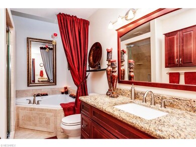 Spa like bath with Jacuzzi tub, separate shower, a