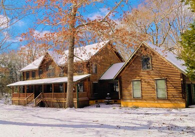 Cabin with a porch and log siding