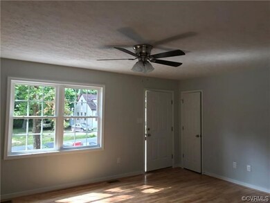Living Room with LVP flooring on previously built