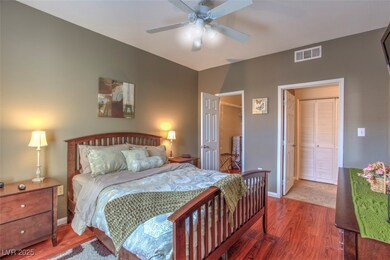 Bedroom with wood finished floors and a ceiling fa