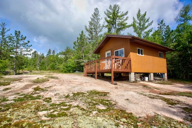 View of side of home with a deck