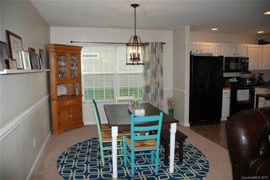 Dining area open to kitchen and den