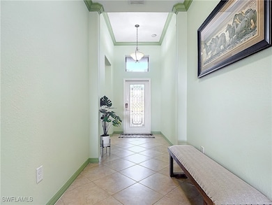 Doorway to outside featuring visible vents, basebo
