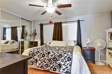 Spacious master bedroom has large mirror door clos
