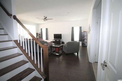 Wooden staircase. Downstairs has 3 BR 2 Bath, upst