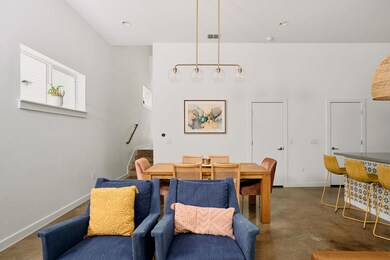 Dining room featuring finished concrete floors an