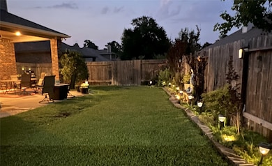 THE BACKYARD IS PERFECT FOR EVENINGS UNDER THE COV