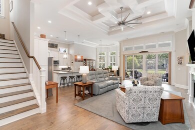 Living room with light hardwood / wood-style floor