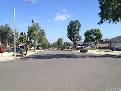Wide street, mature trees, good lighting.