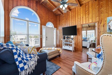 Living room featuring wood ceiling, hardwood / woo