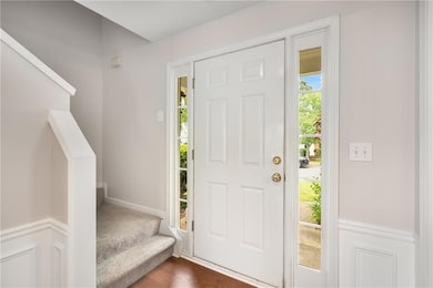 Bright and welcoming entryway featuring sidelights