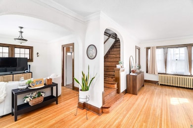 Living area featuring arched walkways, ornamental 