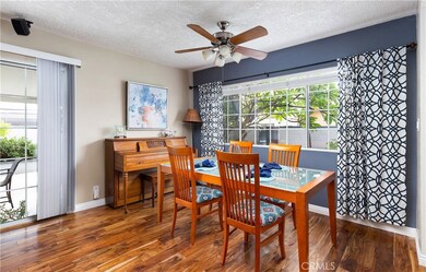 The dining area is open to the kitchen and the living room. The Acacia hardwood floors were installed recently. They look gorgeous and our throughout the house.New baseboards as well.