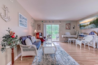 Living room with hardwood / wood-style floors