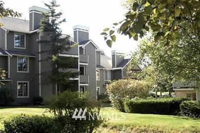 Luscious landscaping surrounding architecturally appealing buildings.  Property is surrounded by a fence.