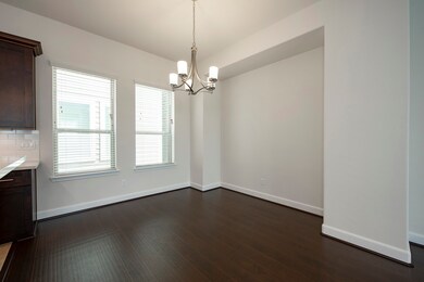 Dinging area with laminate flooring, wall inset
