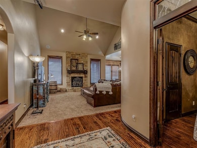 Living room with a fireplace, dark hardwood / wood