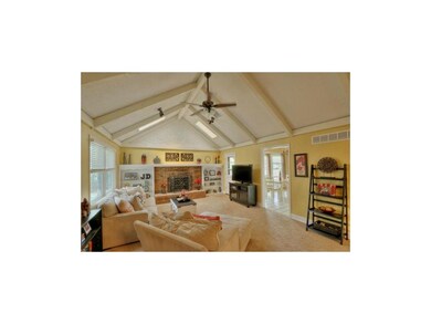 Warm great room features brick front FP and built 