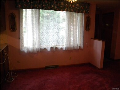 Formal dining room with hard wood floors under car