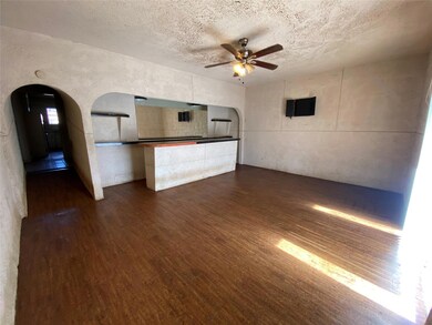 Unfurnished living room with a textured ceiling, d