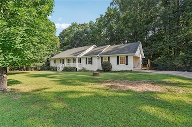 Single story home featuring covered porch