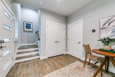 Foyer with wood-type flooring