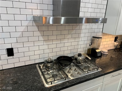 Kitchen view of stainless steel gas stovetop, deco