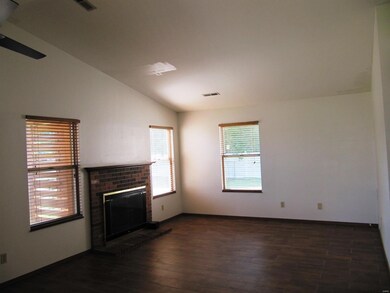 Large great room with woodburning fireplace and be