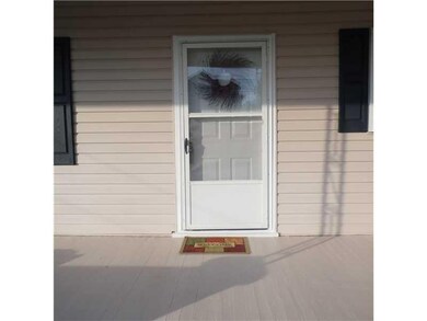 Exterior Front. Large porch in just painted.