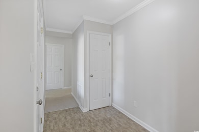 Interior space featuring crown molding