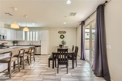 Dining area featuring baseboards, visible vents, r