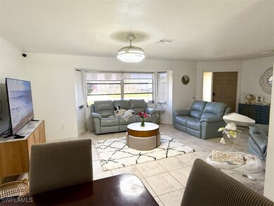 Living area with light tile patterned flooring and