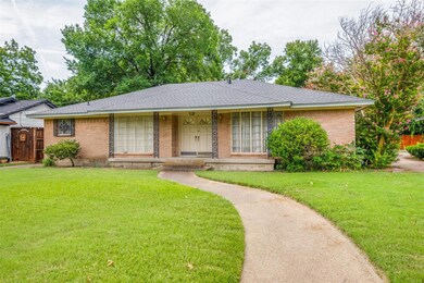 Ranch-style home with a front lawn