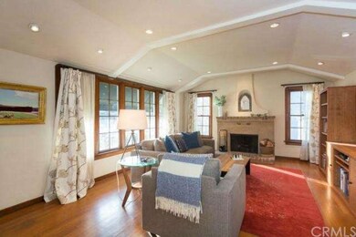 Spacious Living room with beamed ceiling and firep