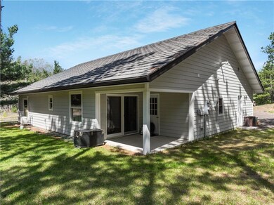 Porch off owners suite and leads to pine forest. No steps. Morning sunshine.
